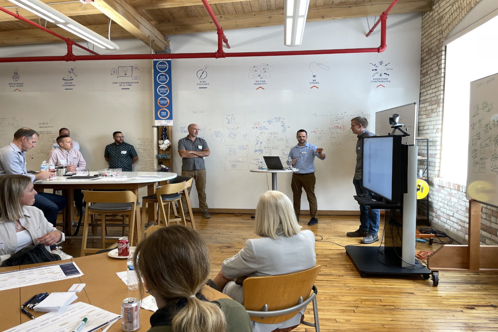 People in a room discussing ITSM project